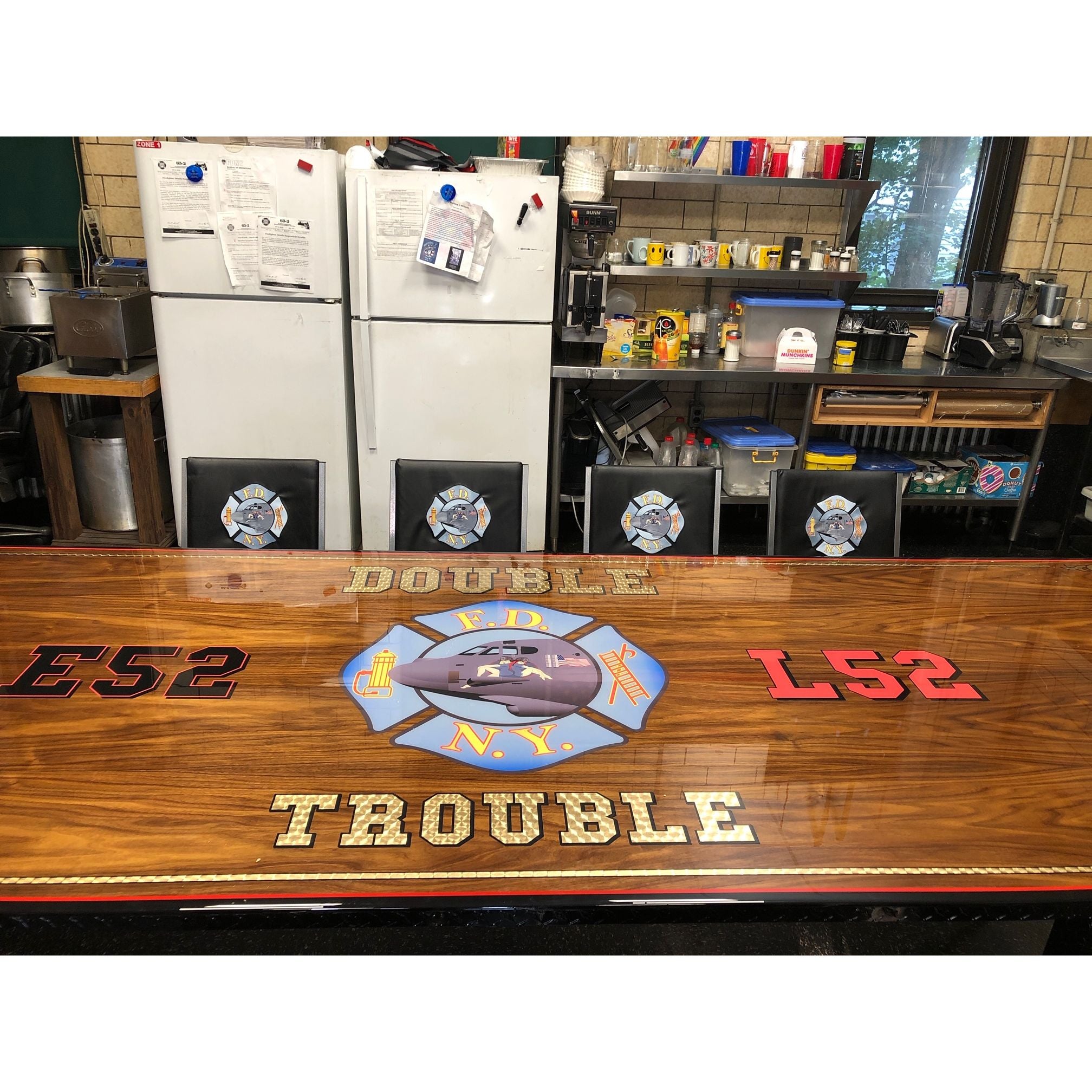 Custom wood top firehouse dining table to FDNY E52 Double Trouble logo