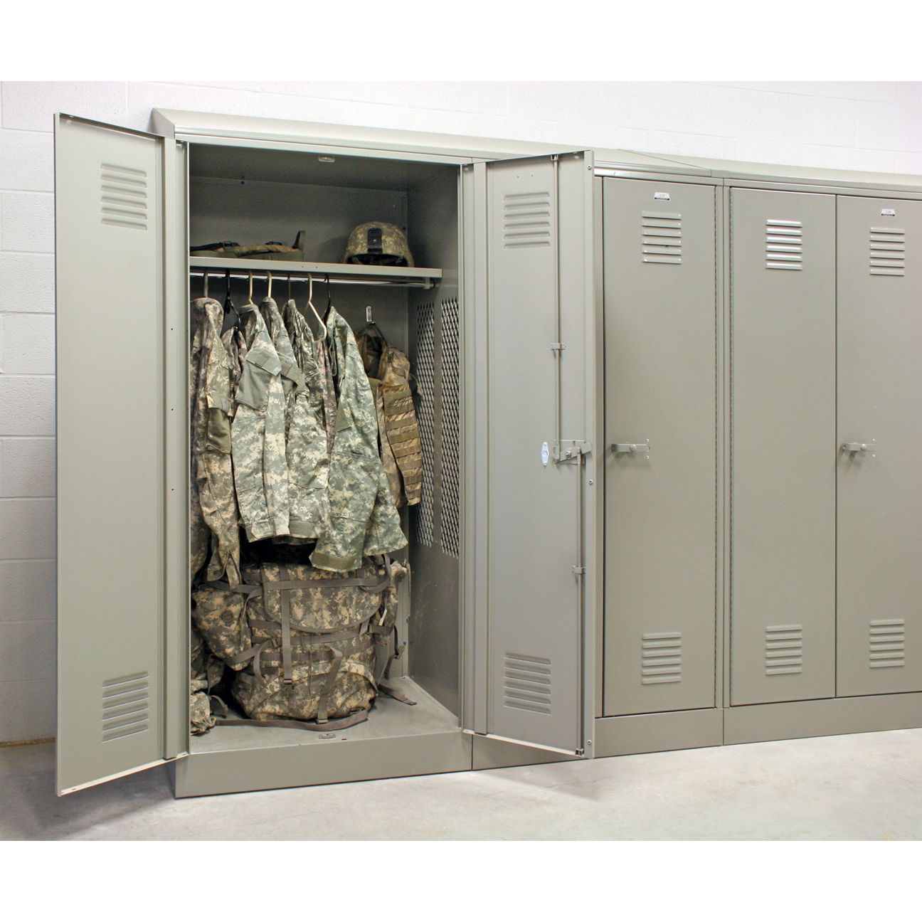 Patriot metal gear locker for firehouse open with gear hanging and on shelves