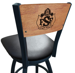 Close up of logo on the custom American firehouse furniture swivel barstool with wood back, black vinyl seat and powder coated frame