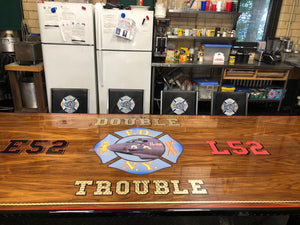 Custom wood top firehouse dining table to FDNY E52 Double Trouble logo
