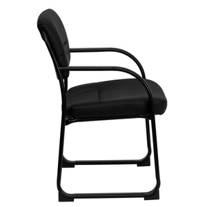 Side view of a black sled base fire station chair with plastic armrests and black vinyl upholstery