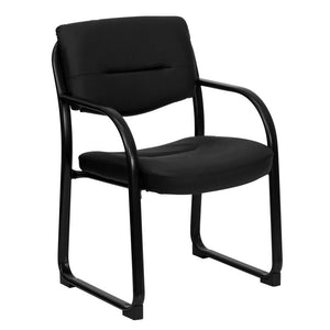 Angled side view of a black sled base fire station chair with plastic armrests and black vinyl upholstery