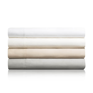 Four cotton blend sheets for fire department mattresses folded on top of one another in colors white, ivory, driftwood and ash 
