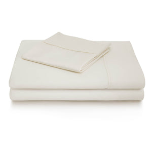 Two white cotton blend sheets for fire department mattresses folded with two white pillow covers folded on top